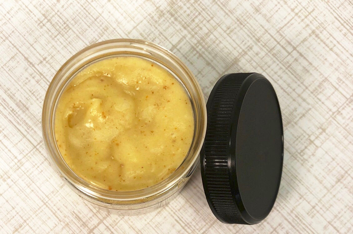 A jar of Humble Bee Farms Healing Cream. Healing Cream is made with herb infused sweet almond oil, beeswax, bee pollen, and raw honey.