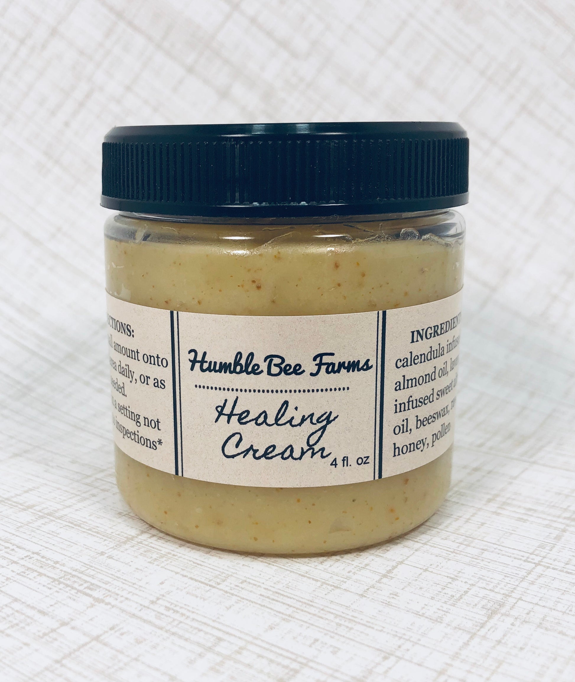 A jar of Humble Bee Farm’s Healing Cream. Healing Cream is made with herb infused sweet almond oil, beeswax, bee pollen, and raw honey.