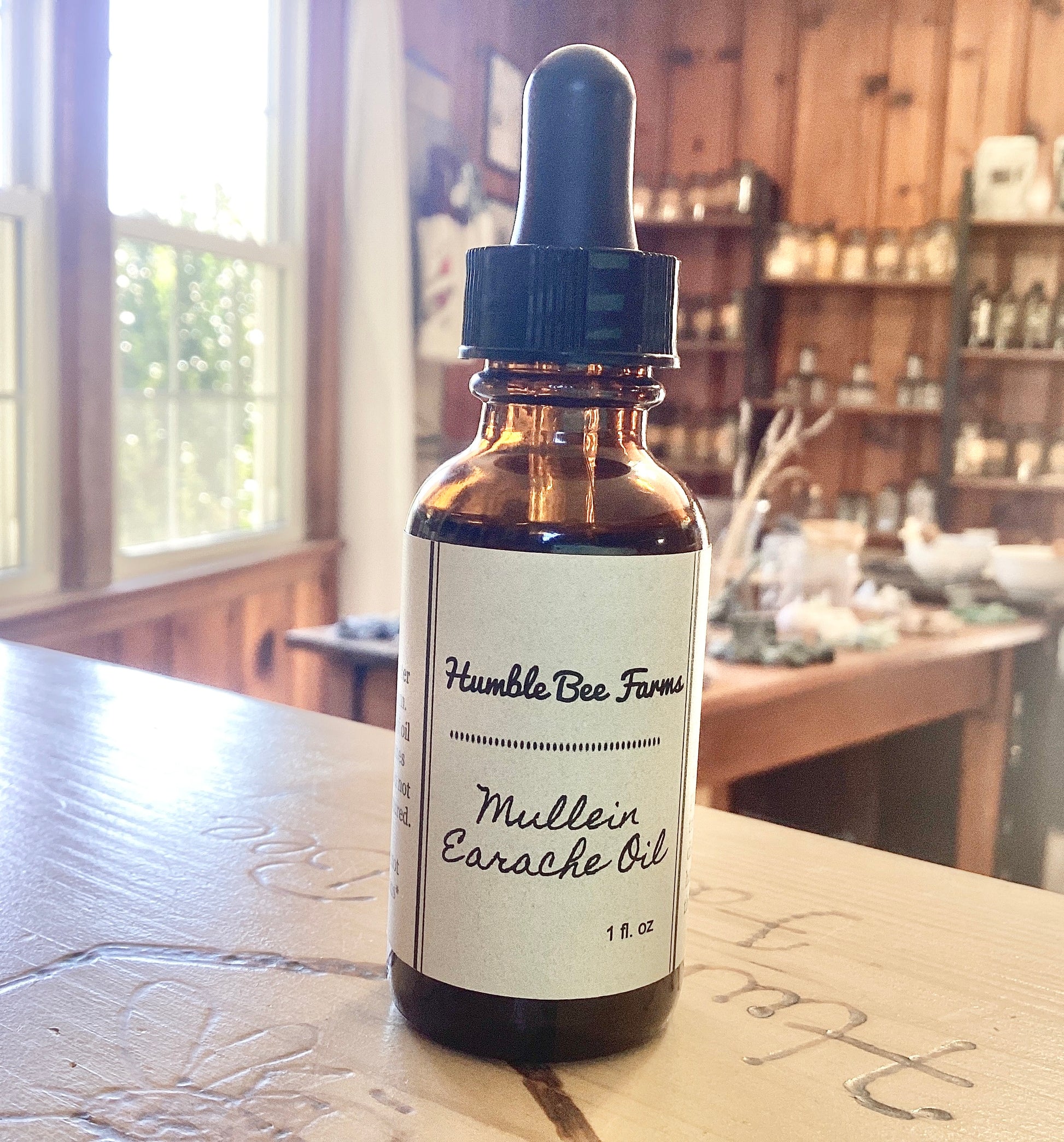 Bottle of Mullein Earache Oil from Humble Bee Farms. Mullein Earache Oil is a time-honored herbal remedy traditionally used to comfort and protect the ears.